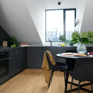 Elka Guild Oak 12mm laminate flooring shown in a room setting