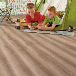 Elka Honey Oak 8mm laminate flooring shown in a room setting